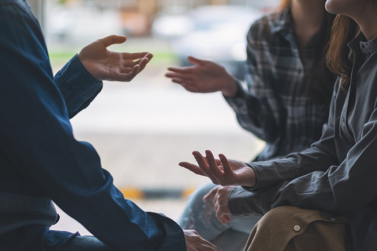 People having conversation together